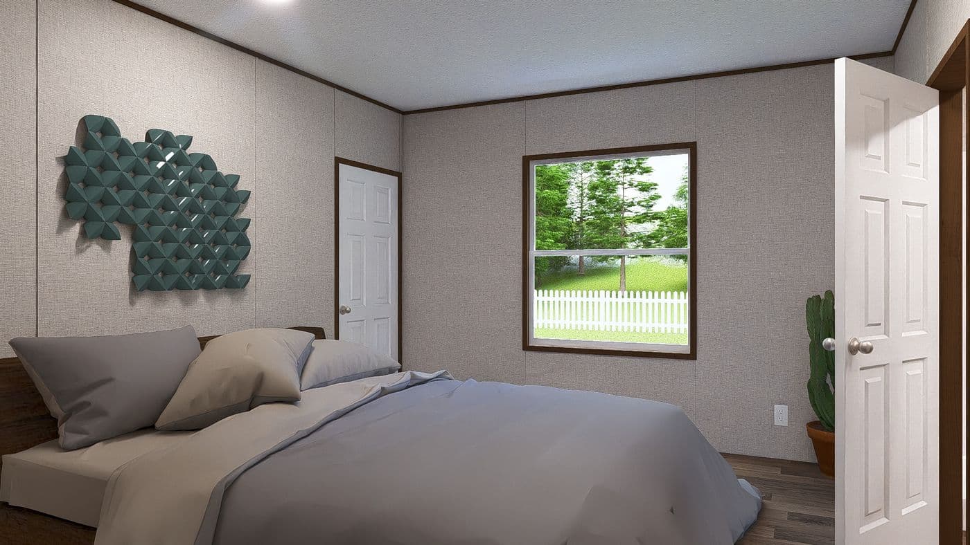The ASPEN Primary Bedroom. This Manufactured Mobile Home features 3 bedrooms and 2 baths.