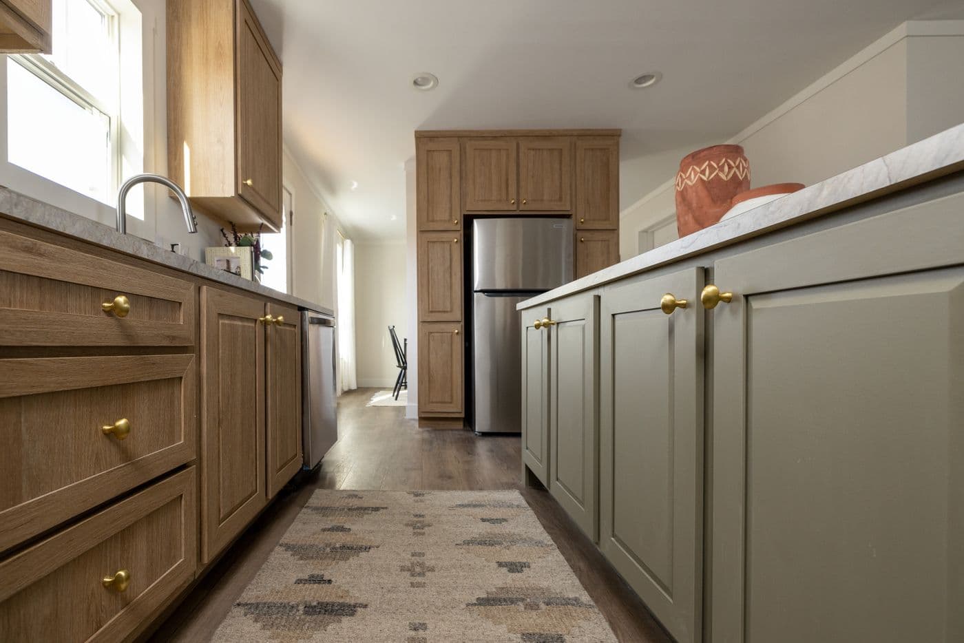 The LET IT BE Kitchen. This Manufactured Mobile Home features 3 bedrooms and 2 baths.