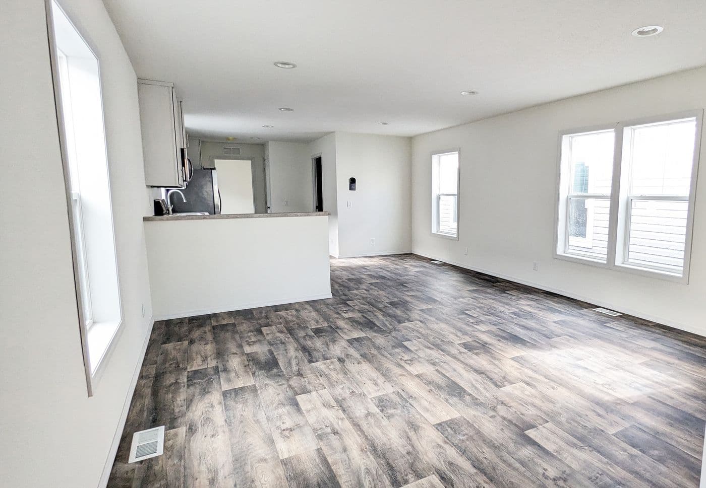The LIFESTYLE 216-1 Living Room. This Manufactured Mobile Home features 3 bedrooms and 2 baths.