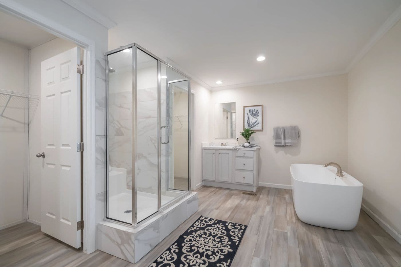 The 4230 "CLEARWATER" 7632 Primary Bathroom. This Manufactured Mobile Home features 4 bedrooms and 2 baths.