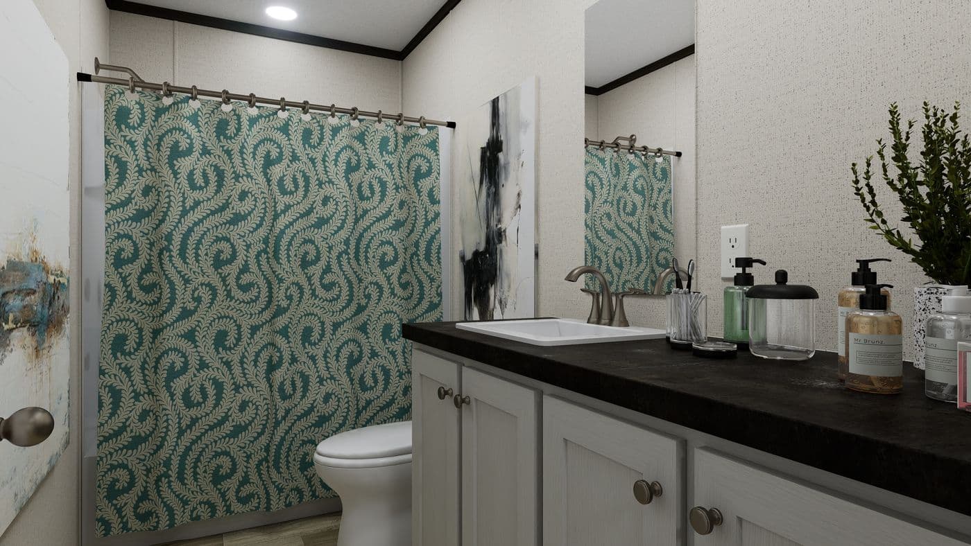 The THE PURPOSE Guest Bathroom. This Manufactured Mobile Home features 4 bedrooms and 2 baths.