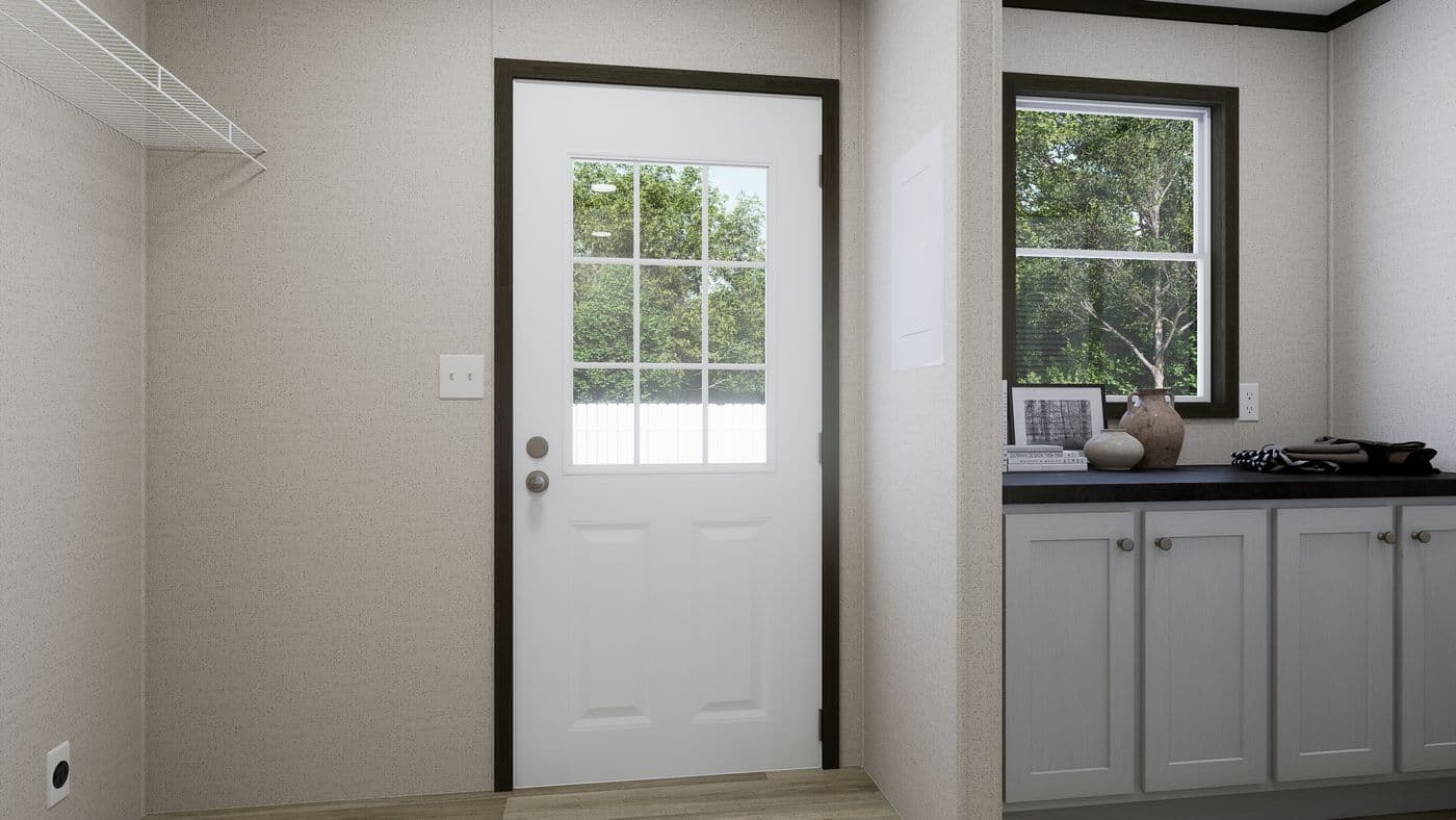 The THE PURPOSE Utility Room. This Manufactured Mobile Home features 4 bedrooms and 2 baths.