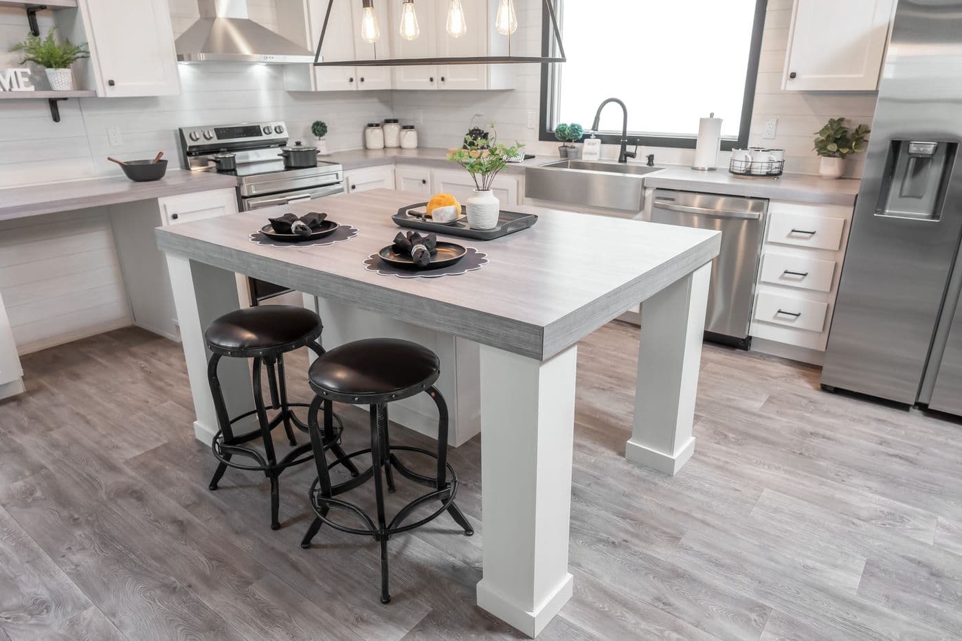 The BREEZE FARMHOUSE Kitchen. This Manufactured Mobile Home features 3 bedrooms and 2 baths.