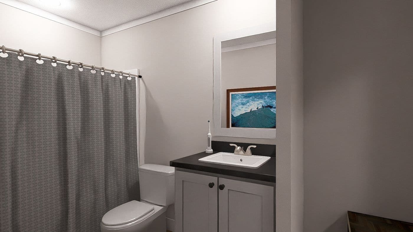 The THREE LITTLE BIRDS Guest Bathroom. This Manufactured Mobile Home features 3 bedrooms and 2 baths.