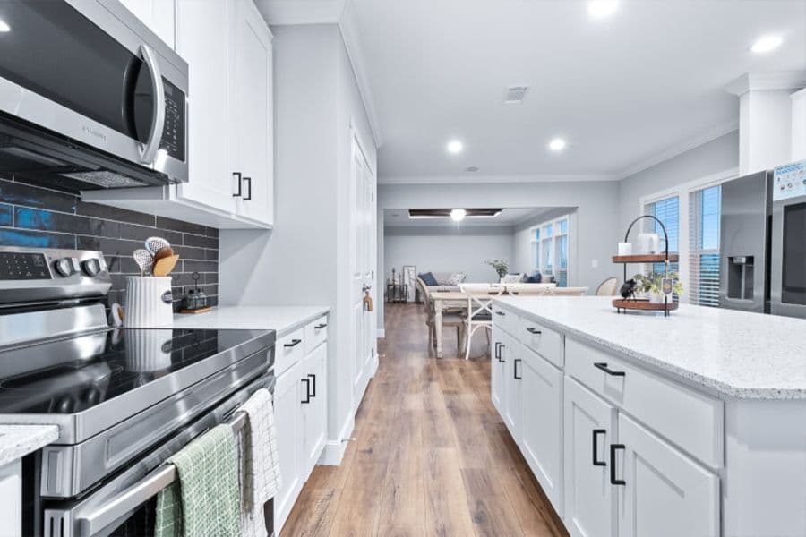 The THE OLYMPUS Kitchen. This Manufactured Mobile Home features 4 bedrooms and 3 baths.