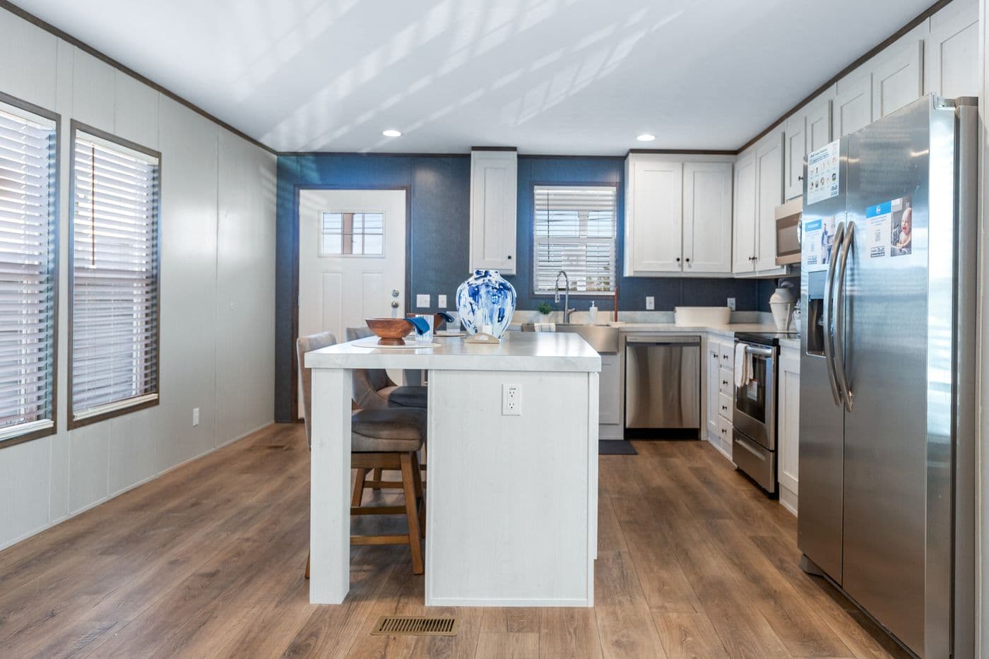 The RETREAT LIVING 16682A Kitchen. This Manufactured Mobile Home features 2 bedrooms and 2 baths.