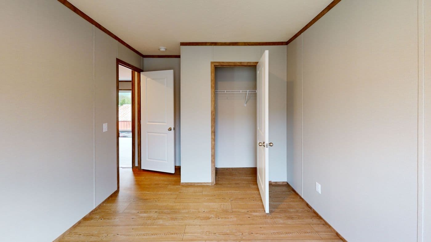 The BOONE Guest Bedroom. This Manufactured Mobile Home features 4 bedrooms and 2 baths.