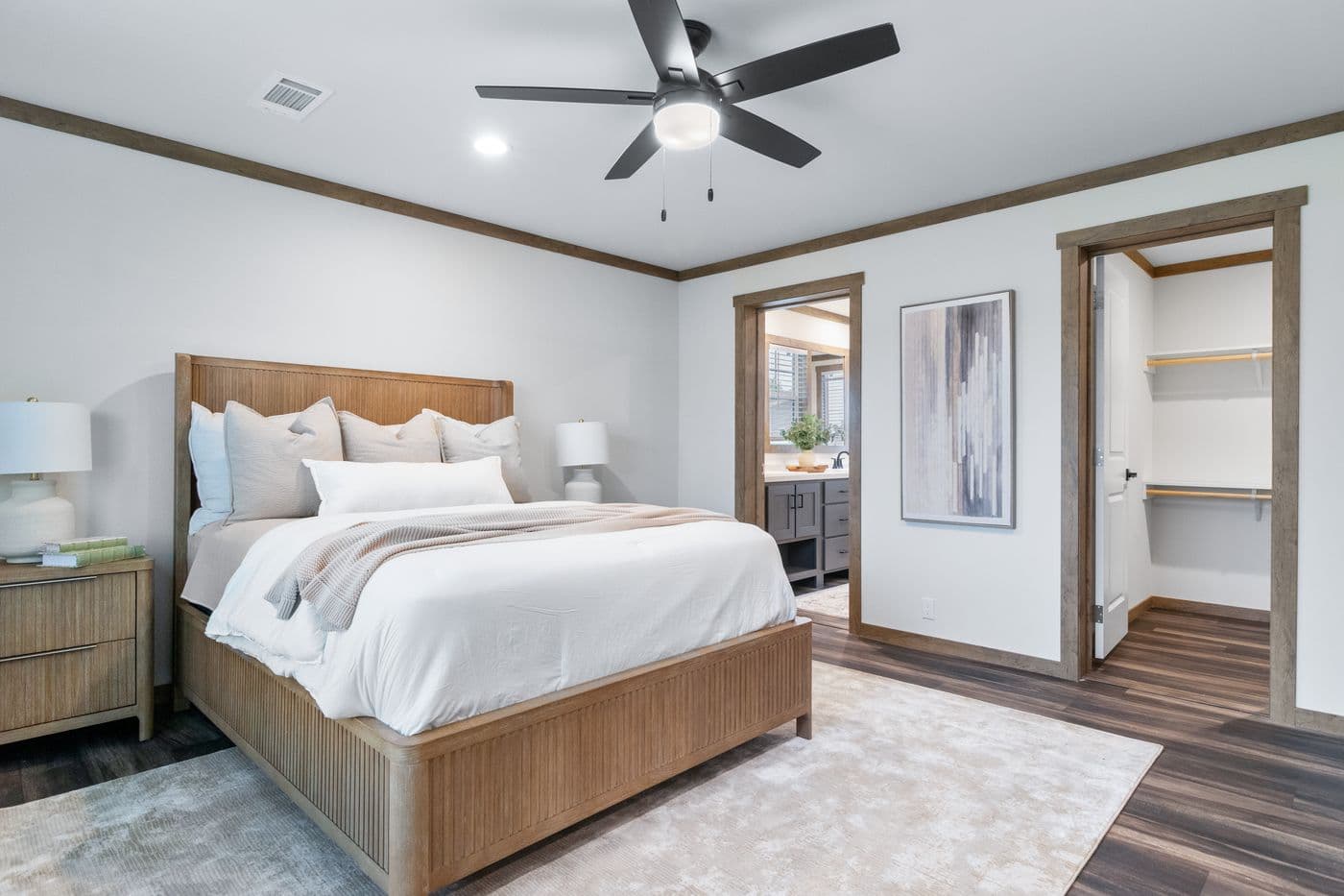 The EVERETT ELITE Primary Bedroom. This Manufactured Mobile Home features 4 bedrooms and 3 baths.