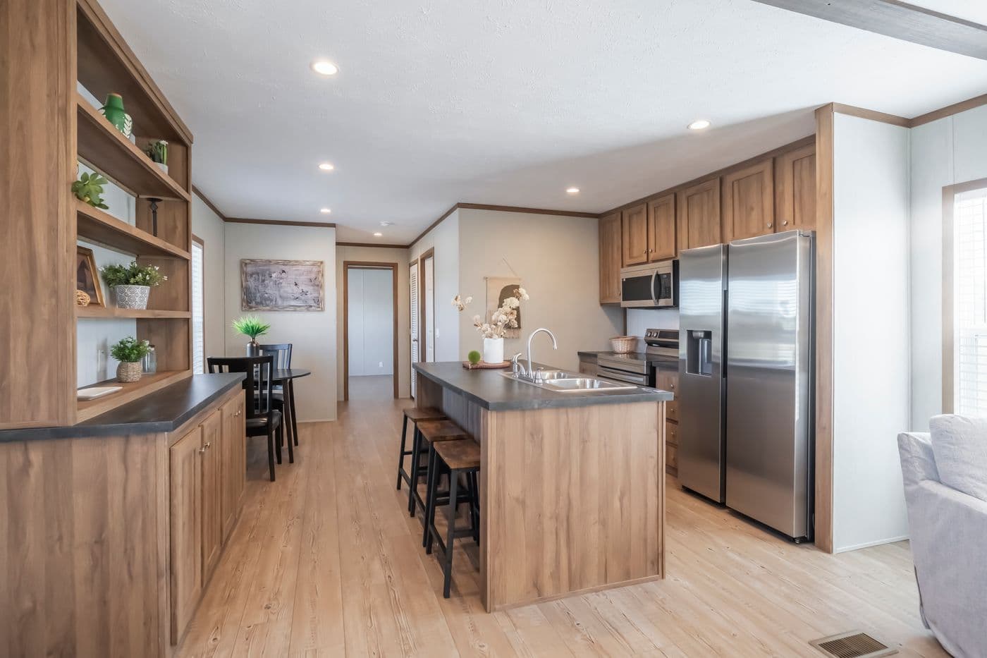 The SEAS THE DAY Kitchen. This Manufactured Mobile Home features 3 bedrooms and 2 baths.