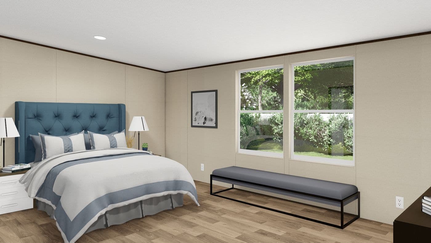 The PRIDE Primary Bedroom. This Manufactured Mobile Home features 4 bedrooms and 2 baths.