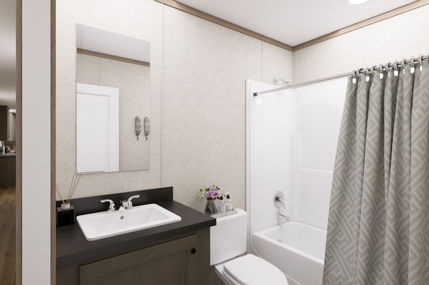 The 7616-CC01 CORNERSTONE 76 Guest Bathroom. This Manufactured Mobile Home features 3 bedrooms and 2 baths.