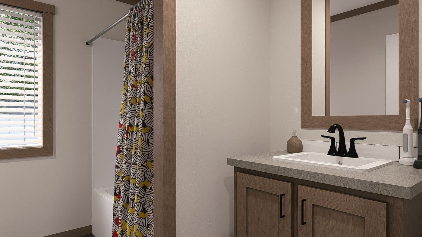 The EMILIE Guest Bathroom. This Manufactured Mobile Home features 3 bedrooms and 2 baths.