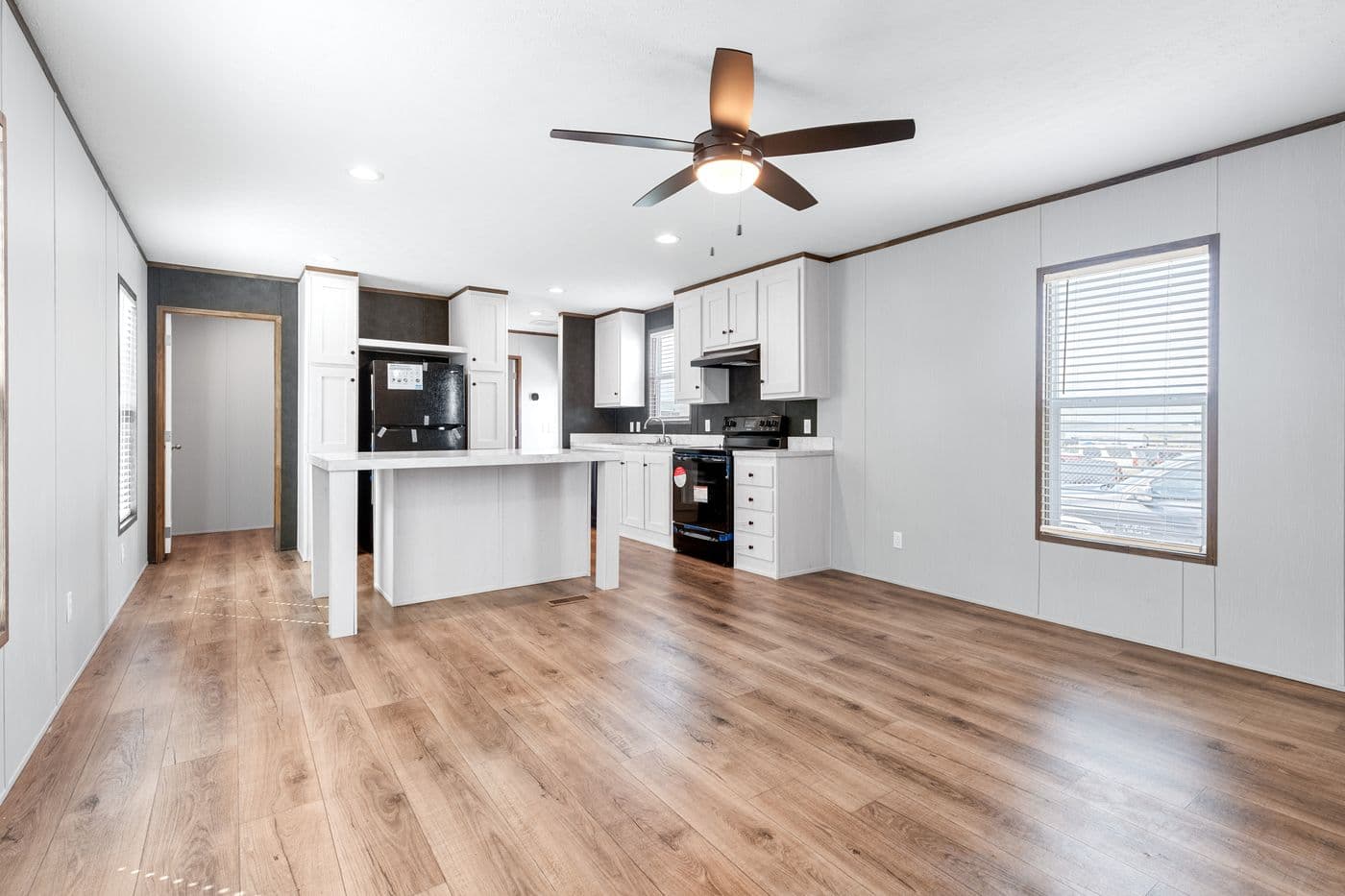 The HOMESTEAD 16602A Kitchen. This Manufactured Mobile Home features 2 bedrooms and 2 baths.