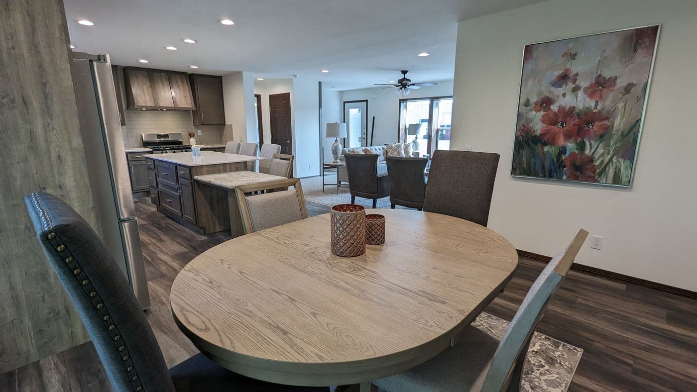 The LEGEND 327-1 Dining Room. This Manufactured Mobile Home features 3 bedrooms and 2 baths.