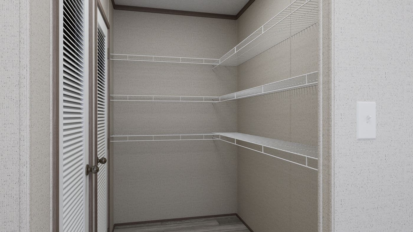 The THE MOUNTAINEER 60 Utility Room. This Manufactured Mobile Home features 3 bedrooms and 2 baths.
