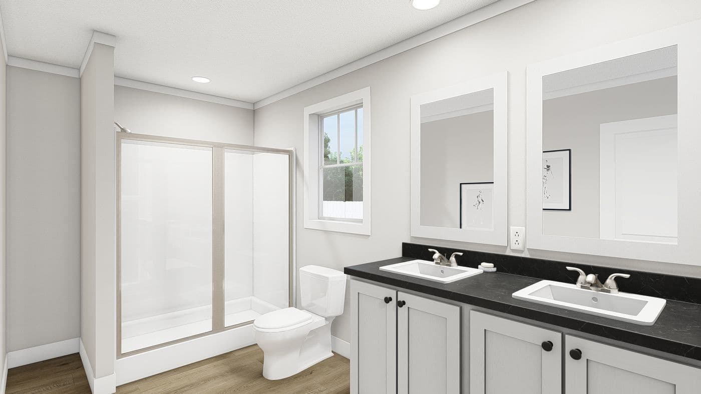 The UNDER PRESSURE Primary Bathroom. This Manufactured Mobile Home features 3 bedrooms and 2 baths.