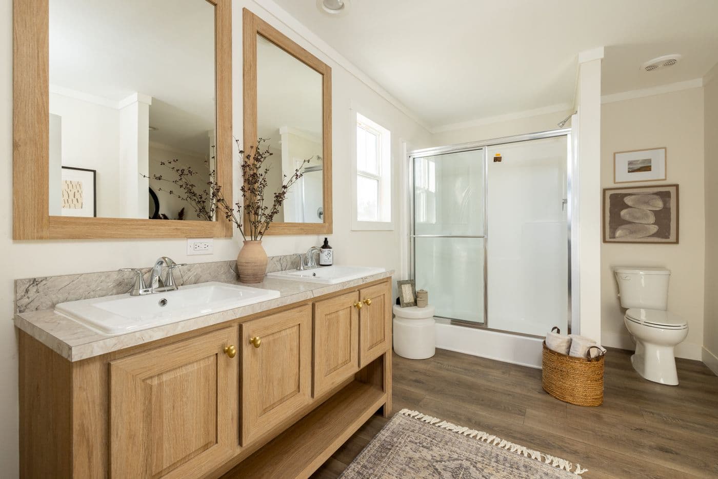 The LET IT BE Primary Bathroom. This Manufactured Mobile Home features 3 bedrooms and 2 baths.