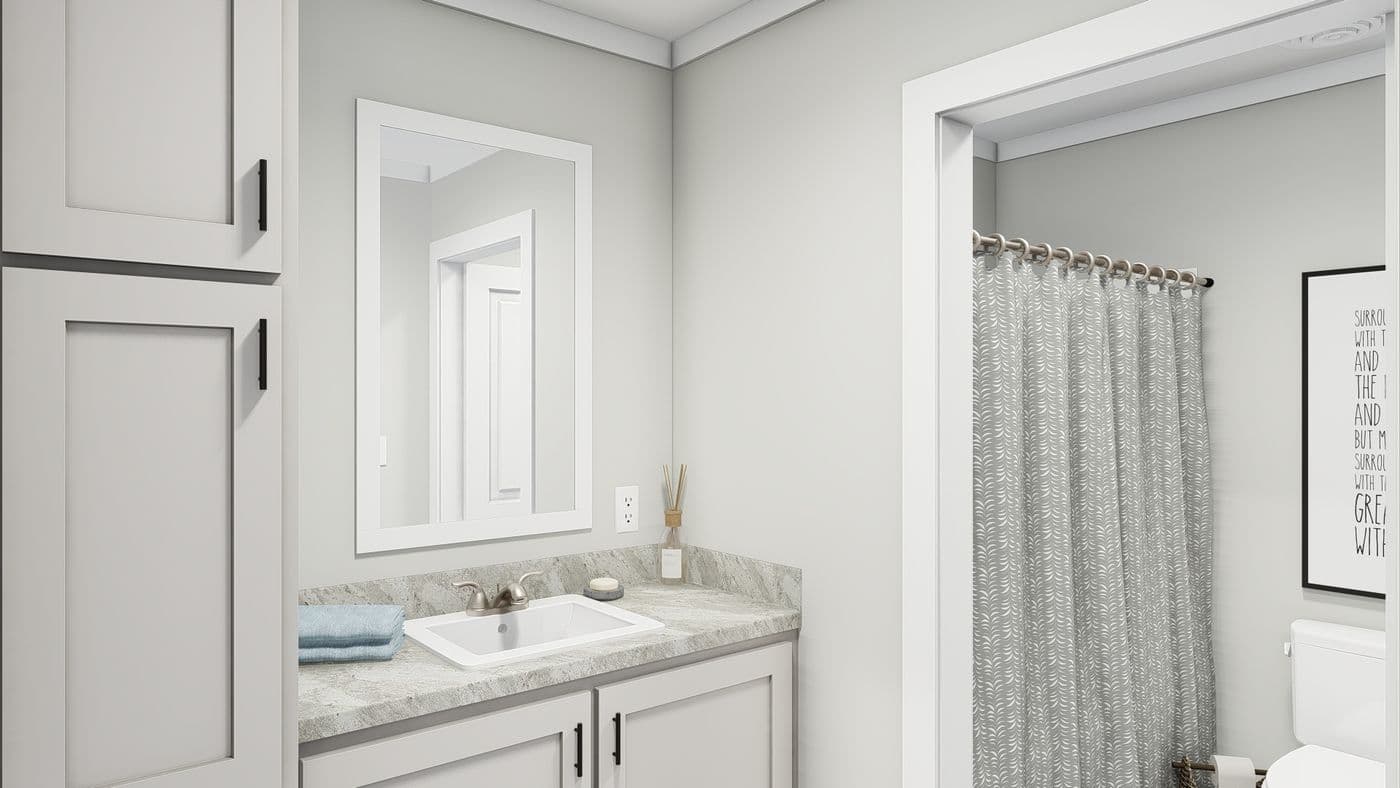 The FRONTIER Guest Bathroom. This Manufactured Mobile Home features 3 bedrooms and 2 baths.