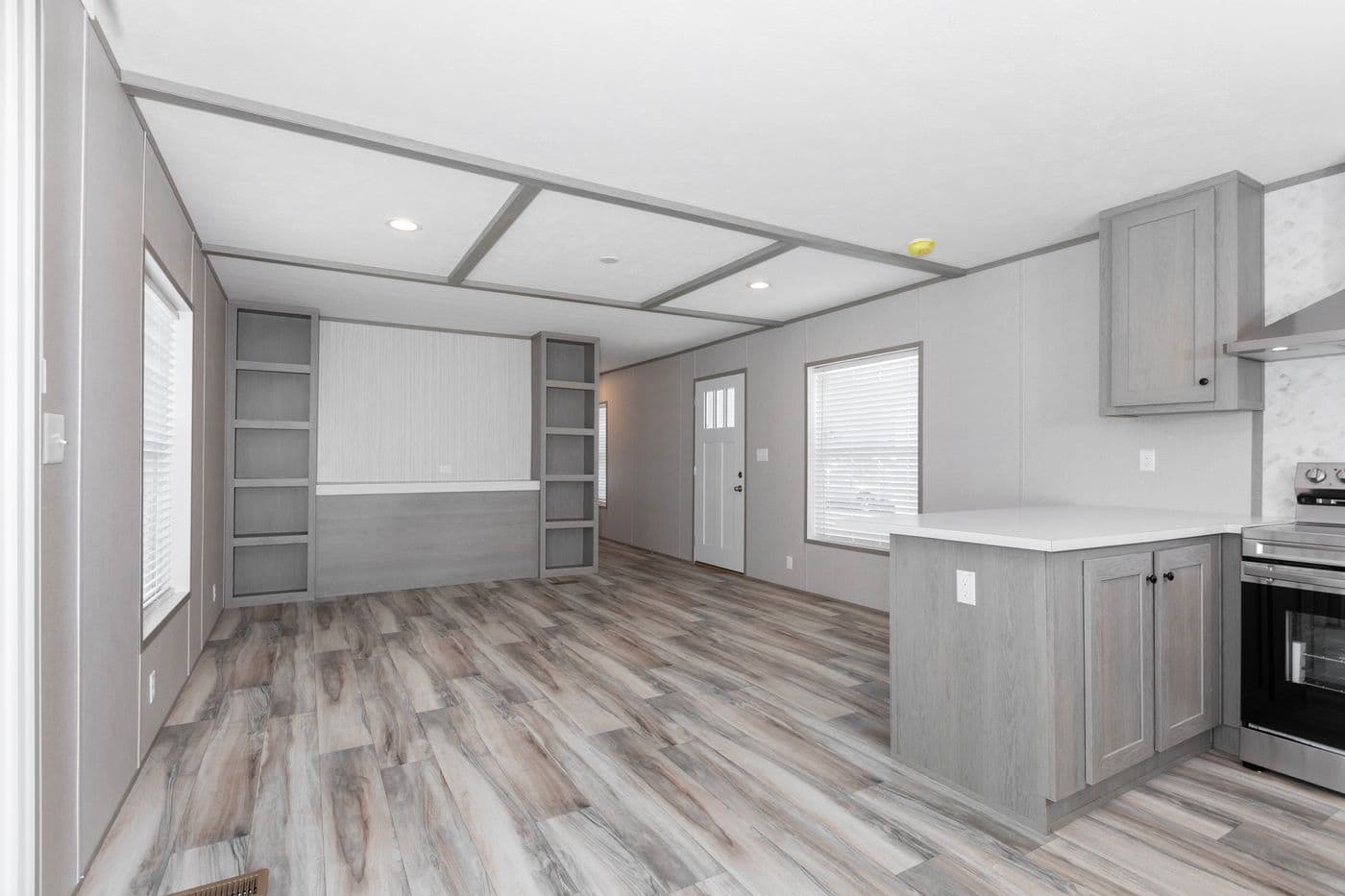 The THE OLYMPUS Living Room. This Manufactured Mobile Home features 3 bedrooms and 2 baths.