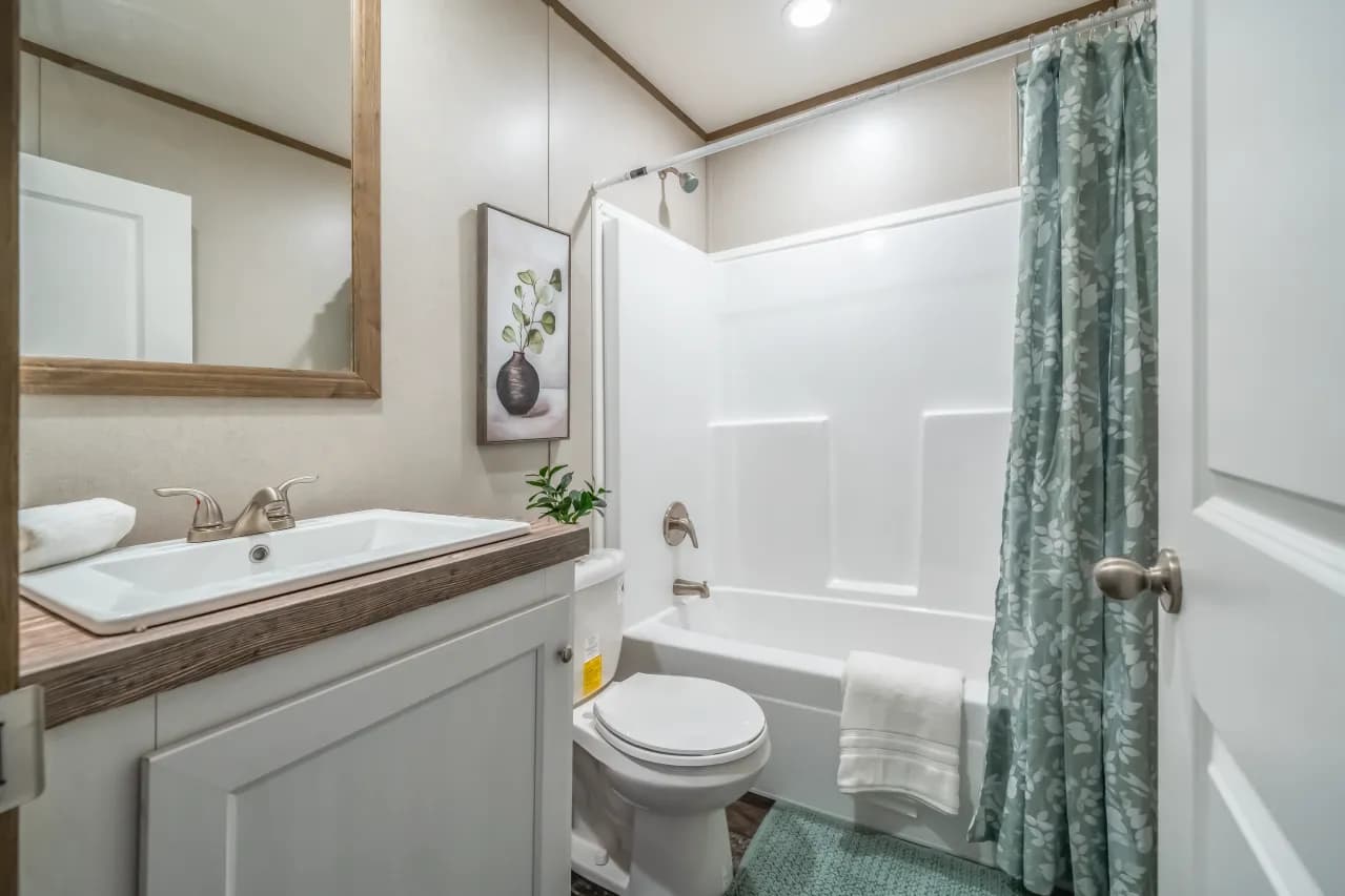 The ANNIVERSARY ENTERTAINER Exterior. This Manufactured Mobile Home features 3 bedrooms and 2 baths.