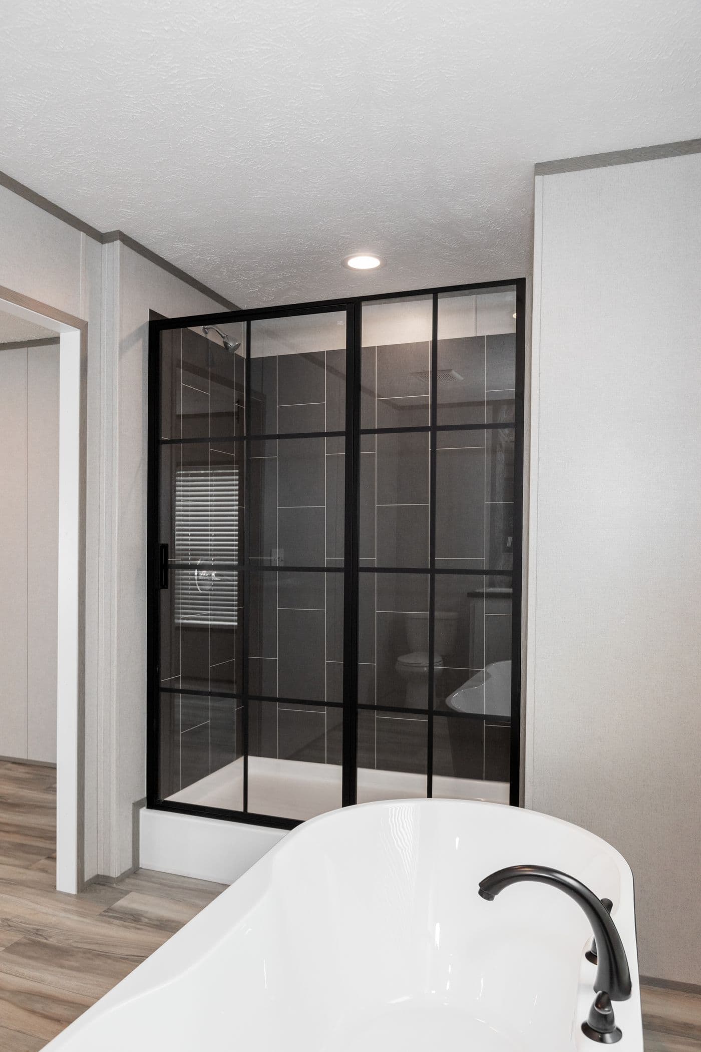 The PLATINUM ANNIVERSARY Primary Bathroom. This Manufactured Mobile Home features 3 bedrooms and 2 baths.