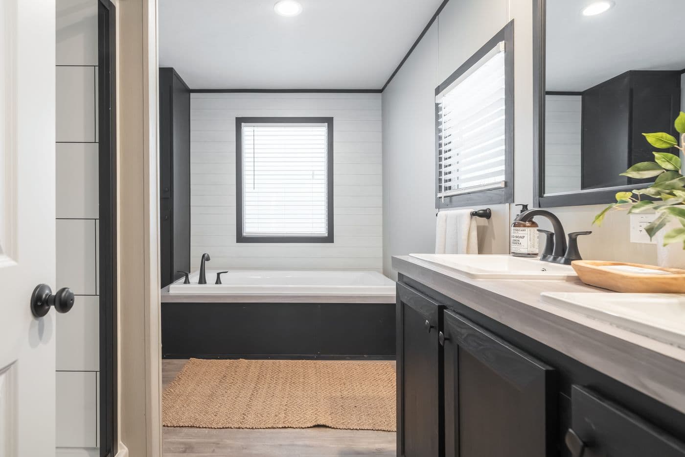 The CRAZY EIGHTS Primary Bathroom. This Manufactured Mobile Home features 4 bedrooms and 2 baths.