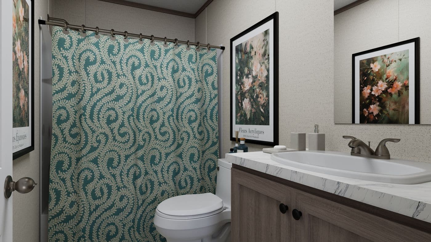 The THE MOUNTAINEER 60 Guest Bathroom. This Manufactured Mobile Home features 3 bedrooms and 2 baths.
