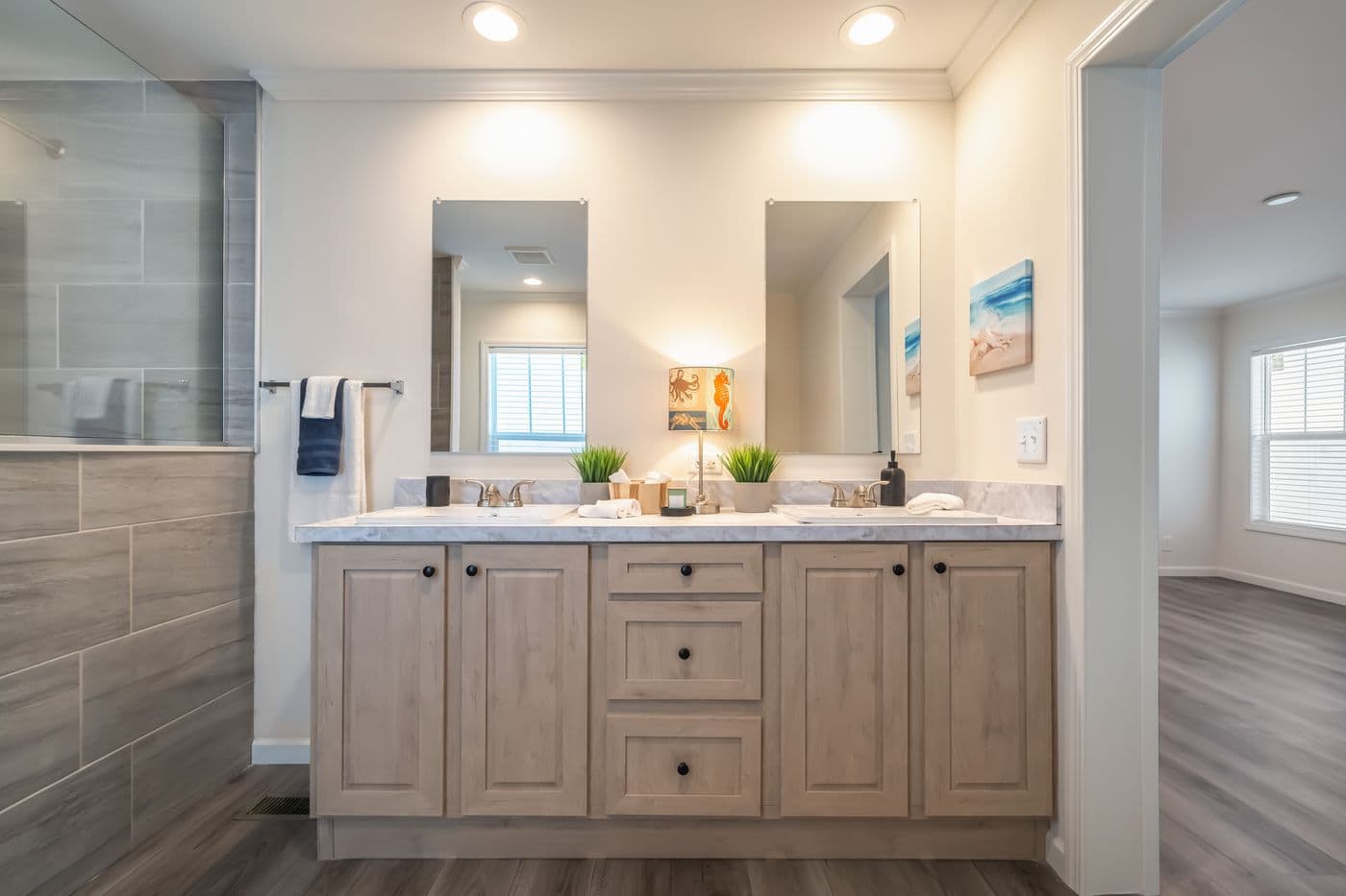 The 4220 "ATLANTIC" 7228 Primary Bathroom. This Manufactured Mobile Home features 3 bedrooms and 2 baths.