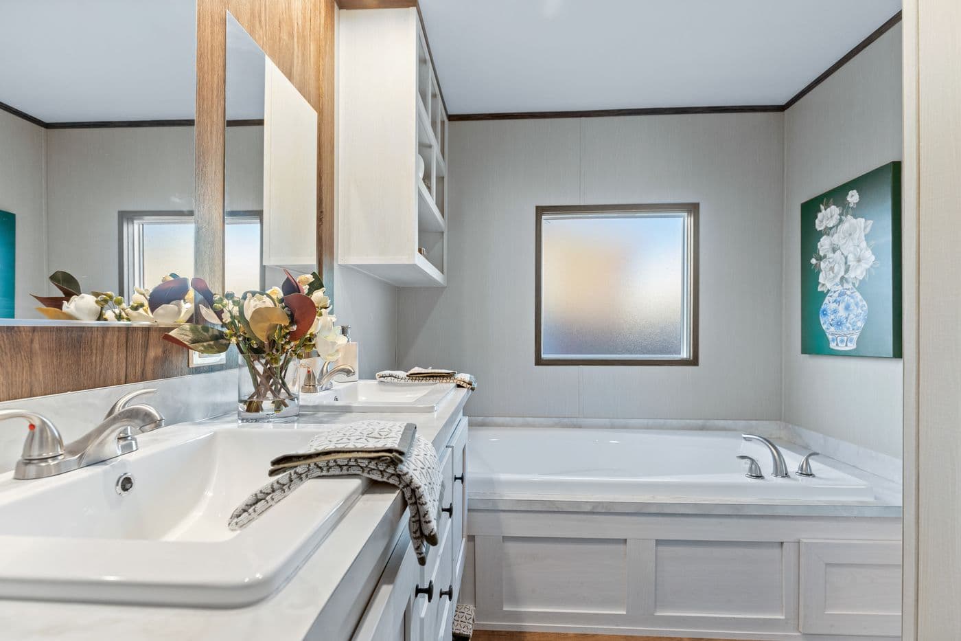 The RETREAT LIVING 16682A Primary Bathroom. This Manufactured Mobile Home features 2 bedrooms and 2 baths.
