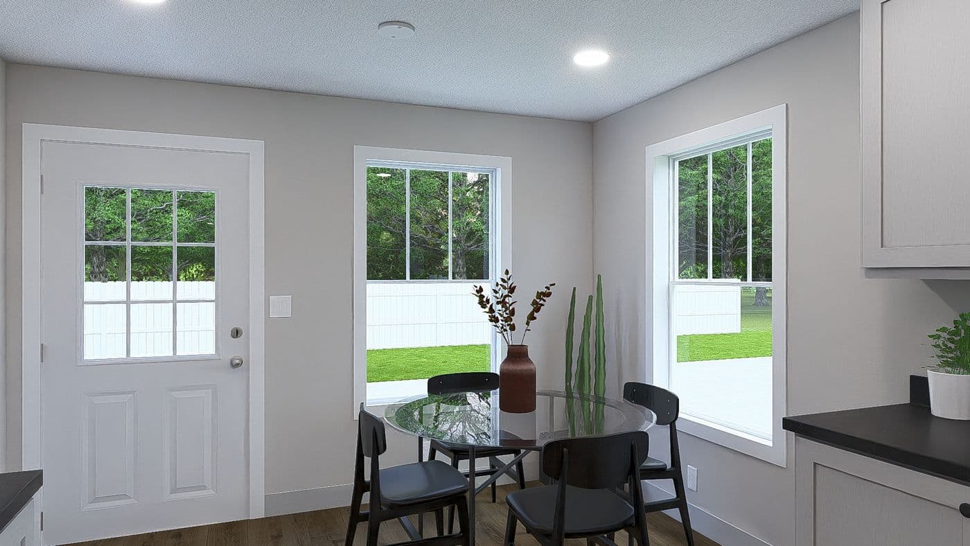 The HERE COMES THE SUN Dining Area. This Manufactured Mobile Home features 3 bedrooms and 2 baths.