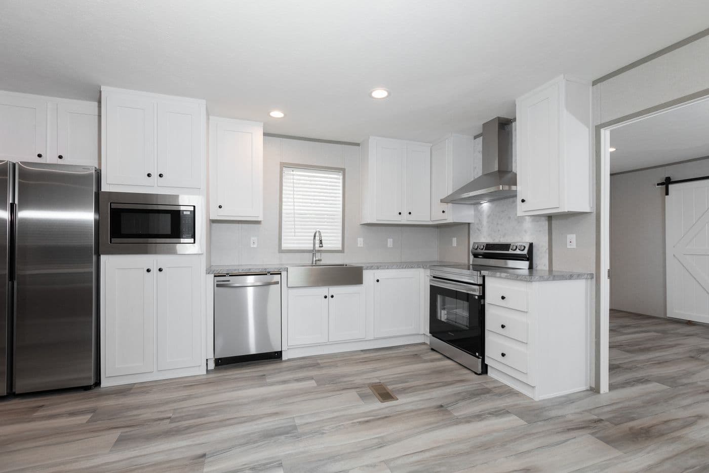 The THE ULTIMATE SHOWER Kitchen. This Manufactured Mobile Home features 3 bedrooms and 2 baths.