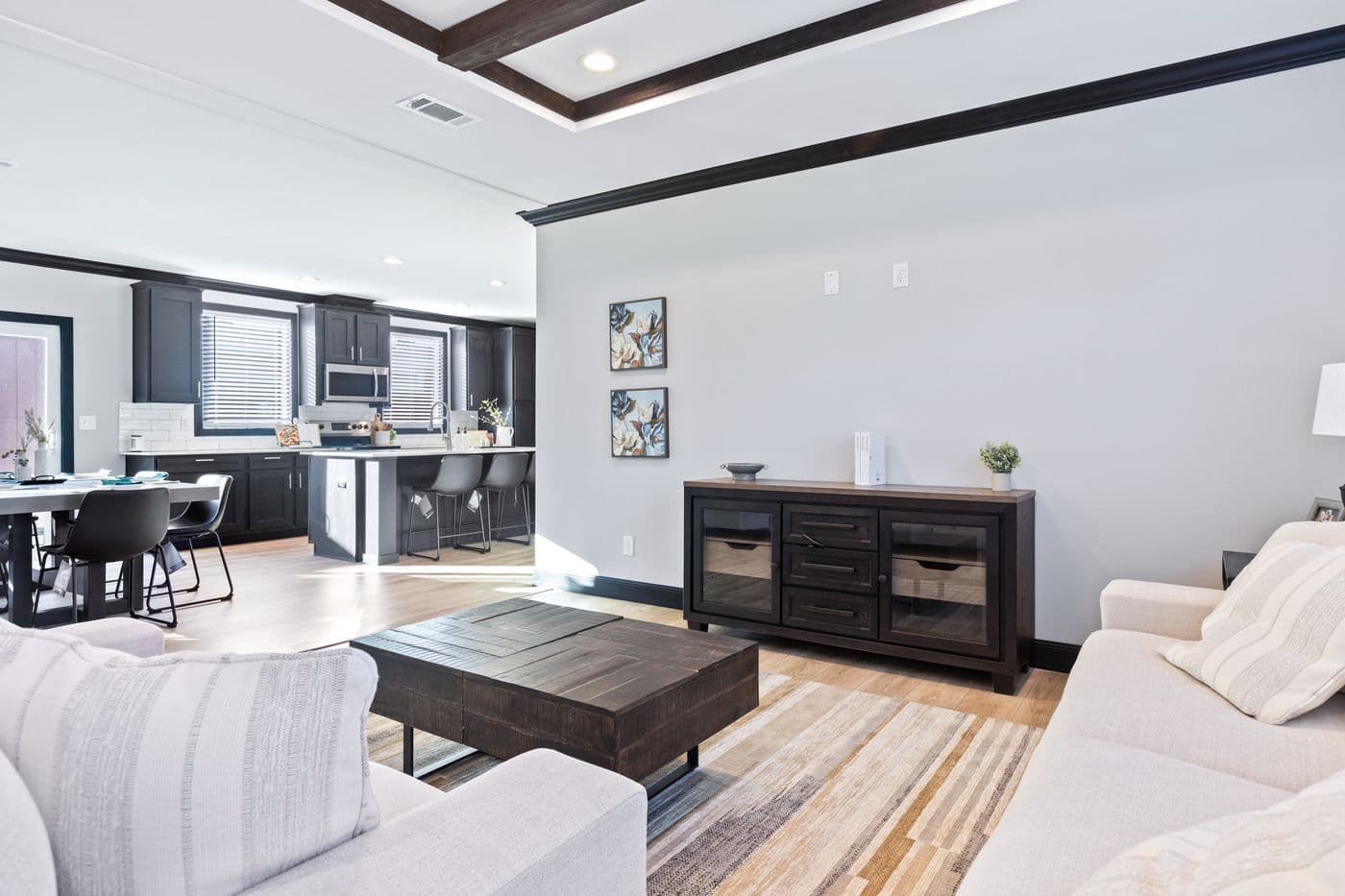 The THE LOUIS Living Room. This Manufactured Mobile Home features 4 bedrooms and 3 baths.
