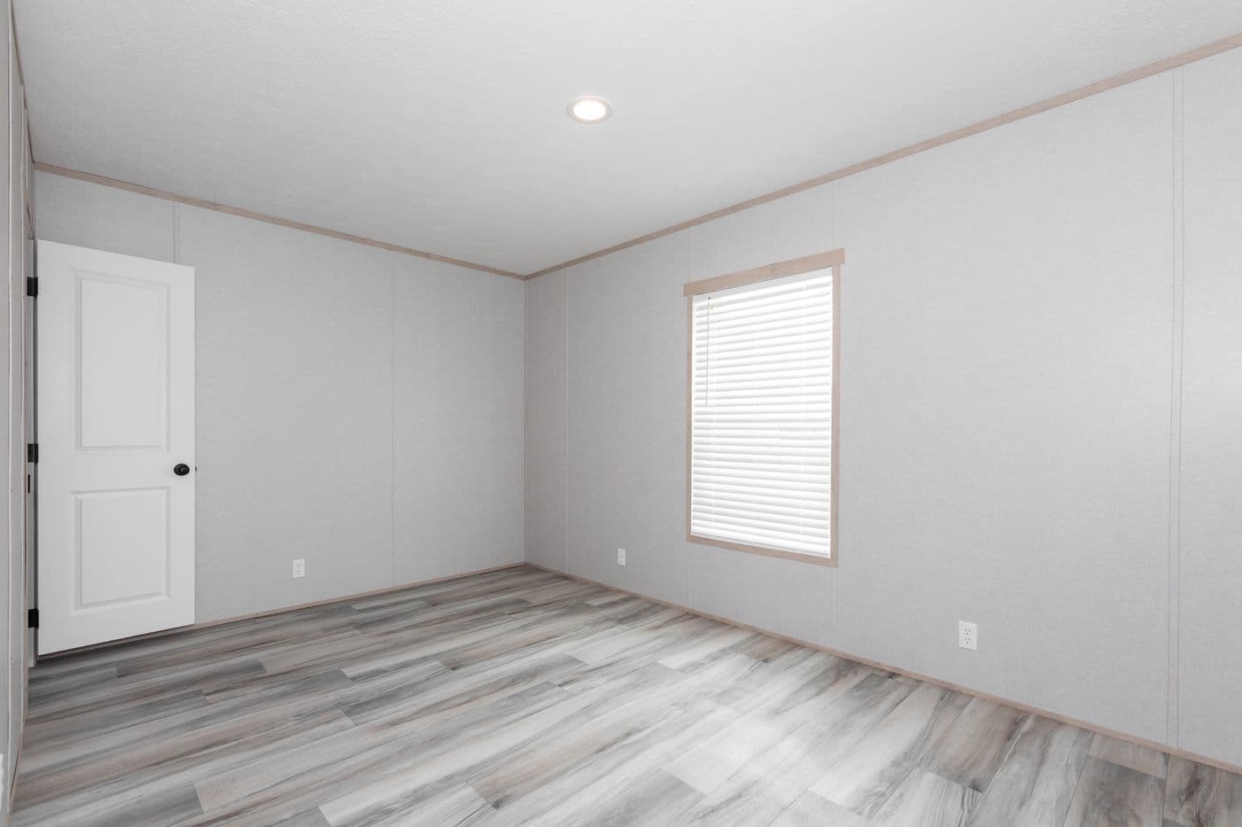 The THE ANNIVERSARY ISLANDER Guest Bedroom. This Manufactured Mobile Home features 3 bedrooms and 2 baths.
