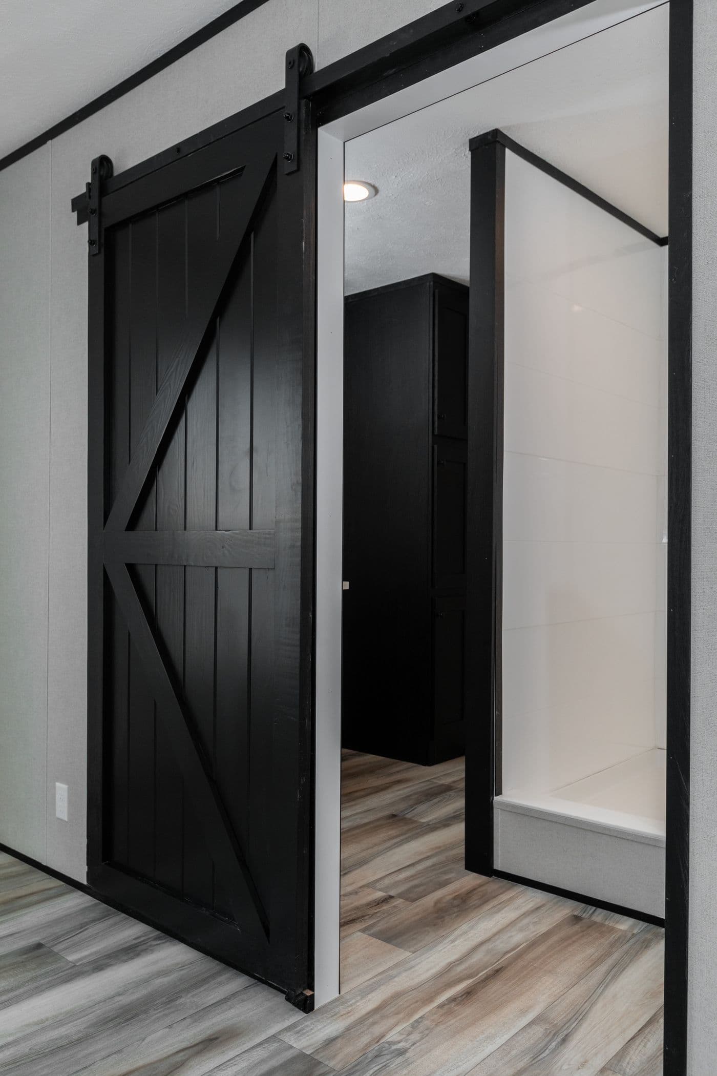 The THE SMOKEY Primary Bedroom. This Manufactured Mobile Home features 3 bedrooms and 2 baths.