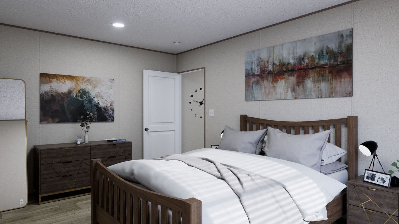 The FOOTHILLS 66 Primary Bedroom. This Manufactured Mobile Home features 3 bedrooms and 2 baths.