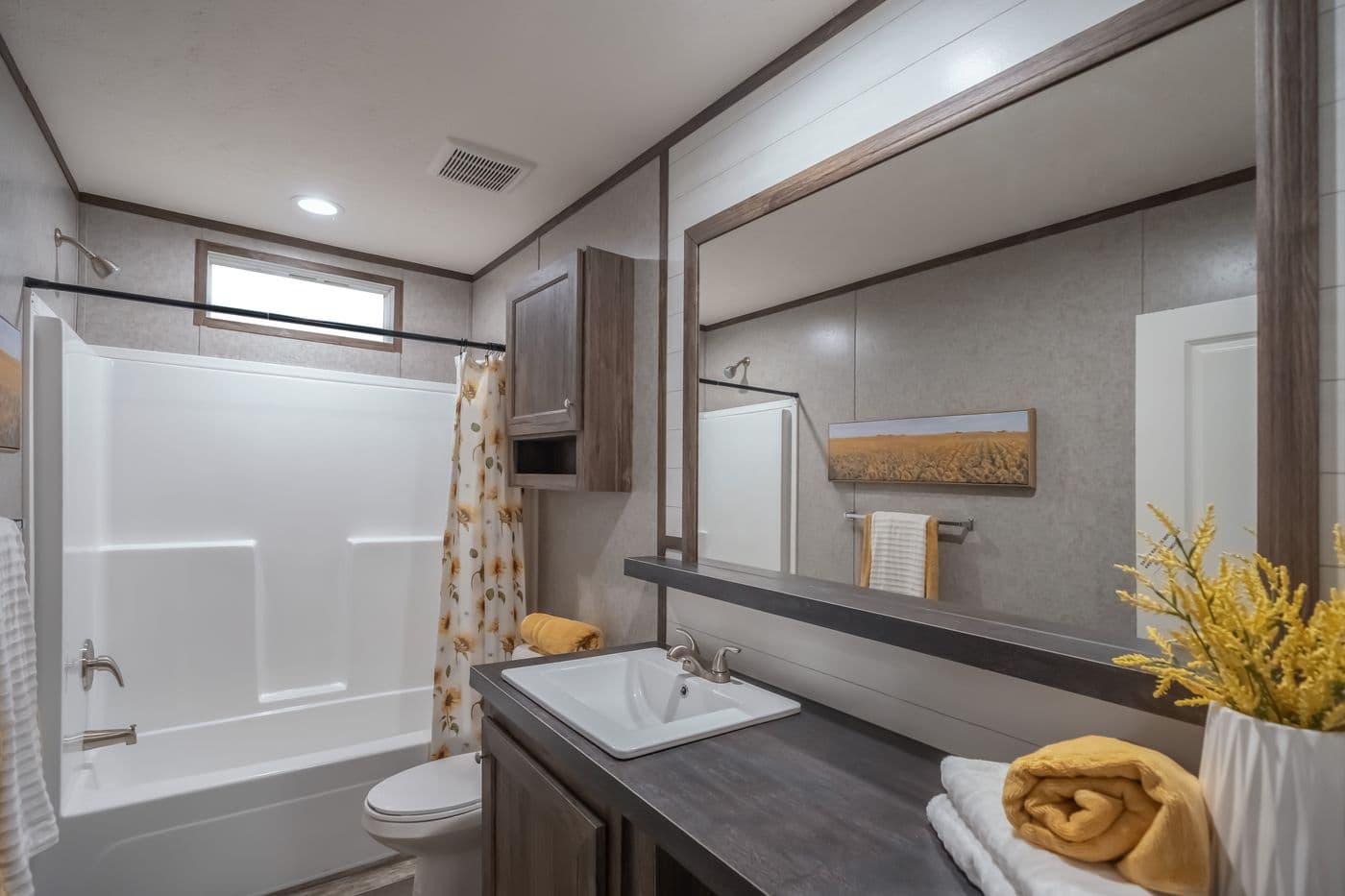 The LOCKLEAR Exterior. This Manufactured Mobile Home features 4 bedrooms and 2 baths.