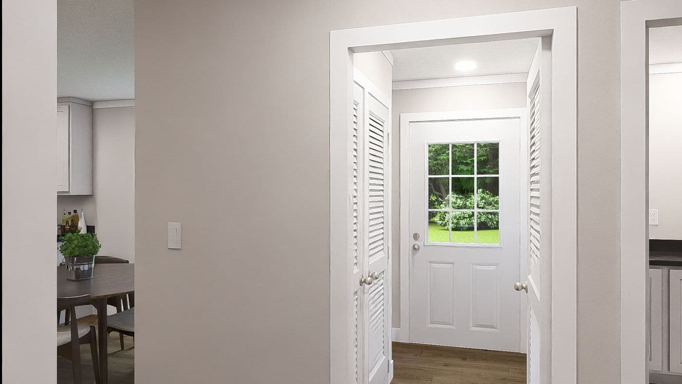 The WONDERFUL WORLD Utility Room. This Manufactured Mobile Home features 3 bedrooms and 2 baths.