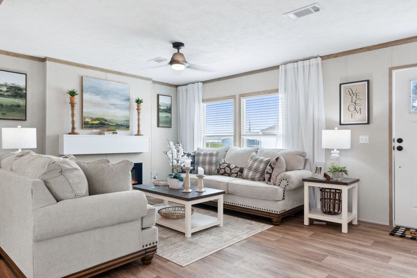 The BREEZE FARMHOUSE 72 Living Room. This Manufactured Mobile Home features 4 bedrooms and 2 baths.