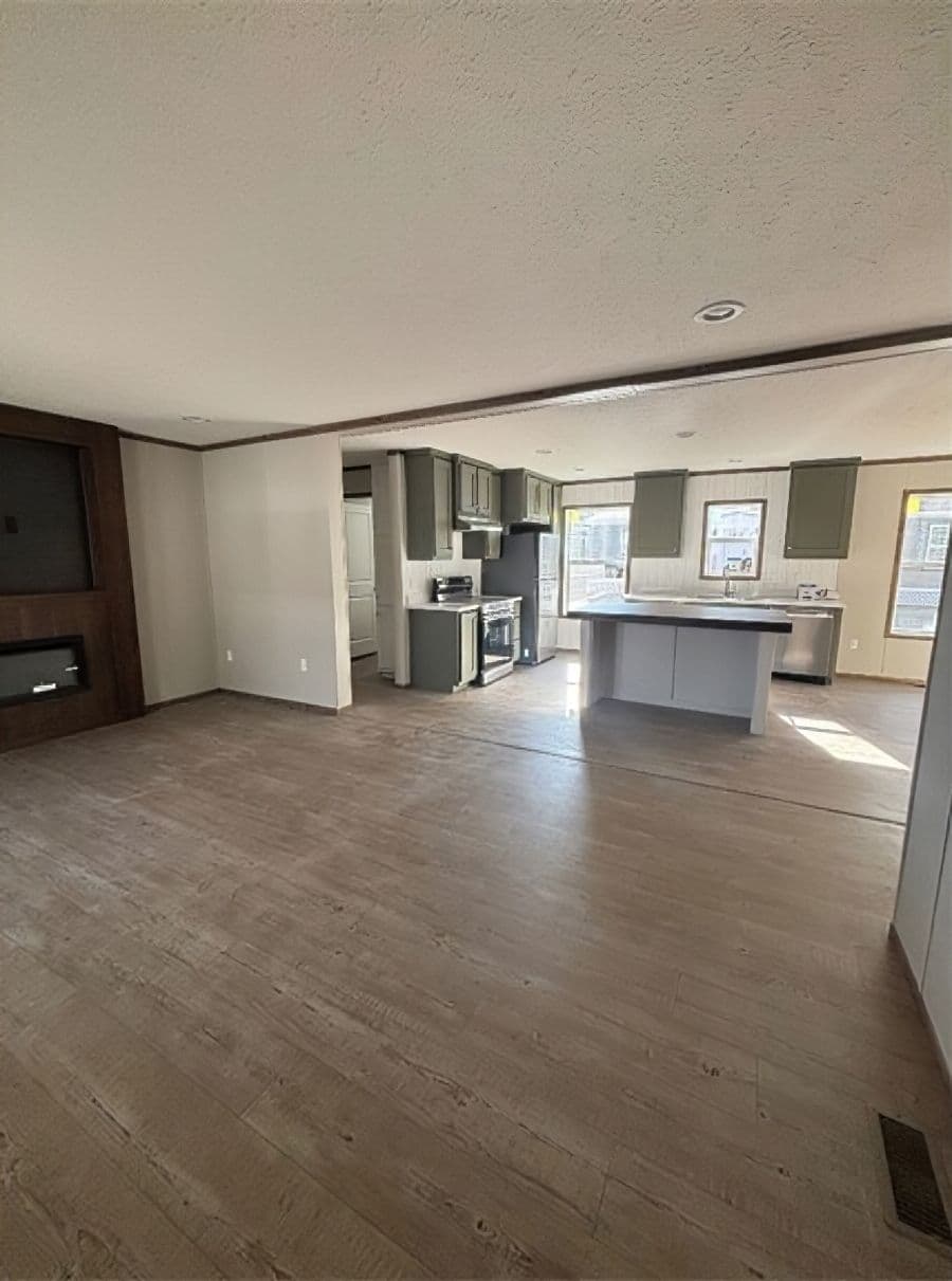 The APATITE 44 Living Room. This Manufactured Mobile Home features 3 bedrooms and 2 baths.