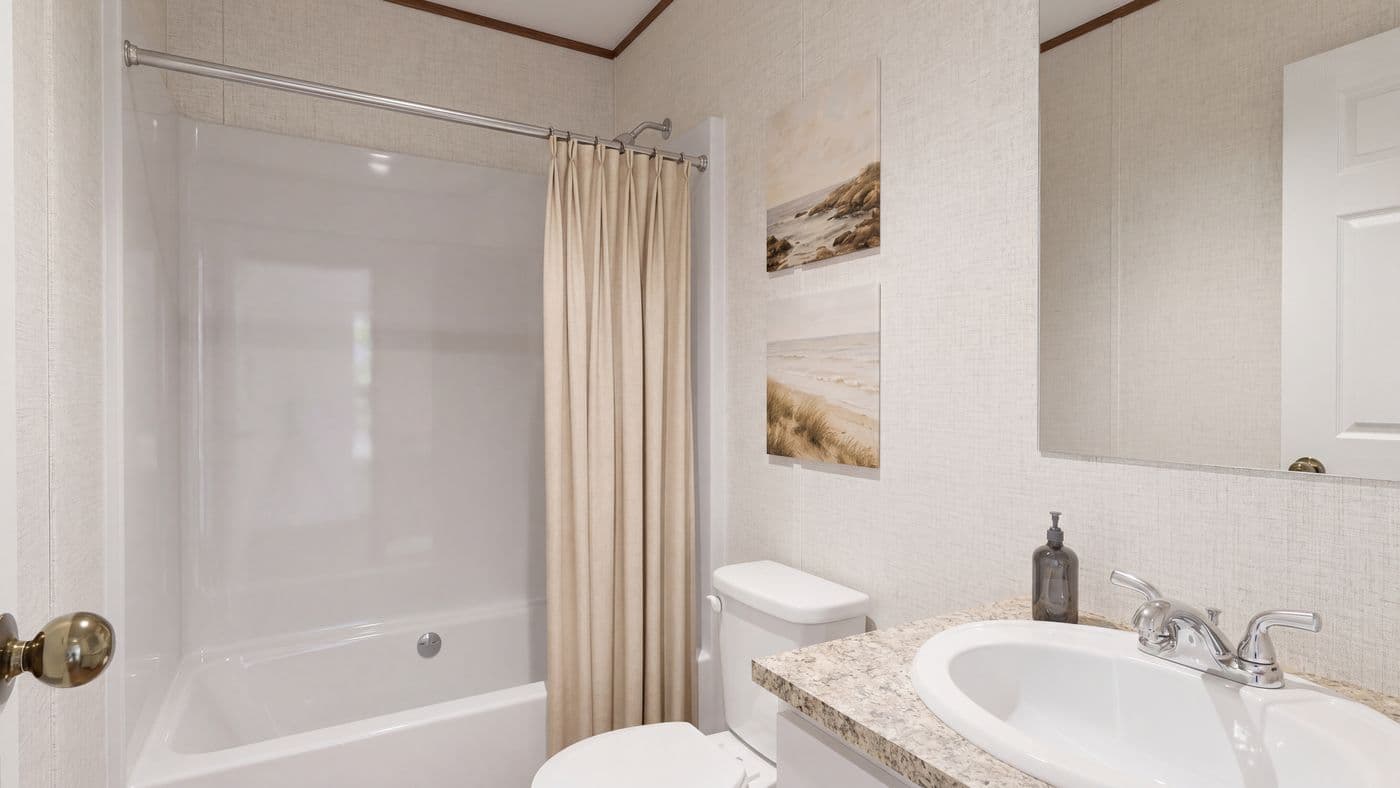 The SYCAMORE Guest Bathroom. This Manufactured Mobile Home features 4 bedrooms and 2 baths.
