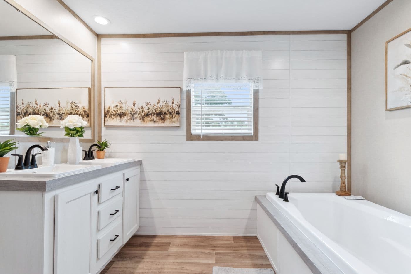 The BREEZE FARMHOUSE 72 Primary Bathroom. This Manufactured Mobile Home features 4 bedrooms and 2 baths.