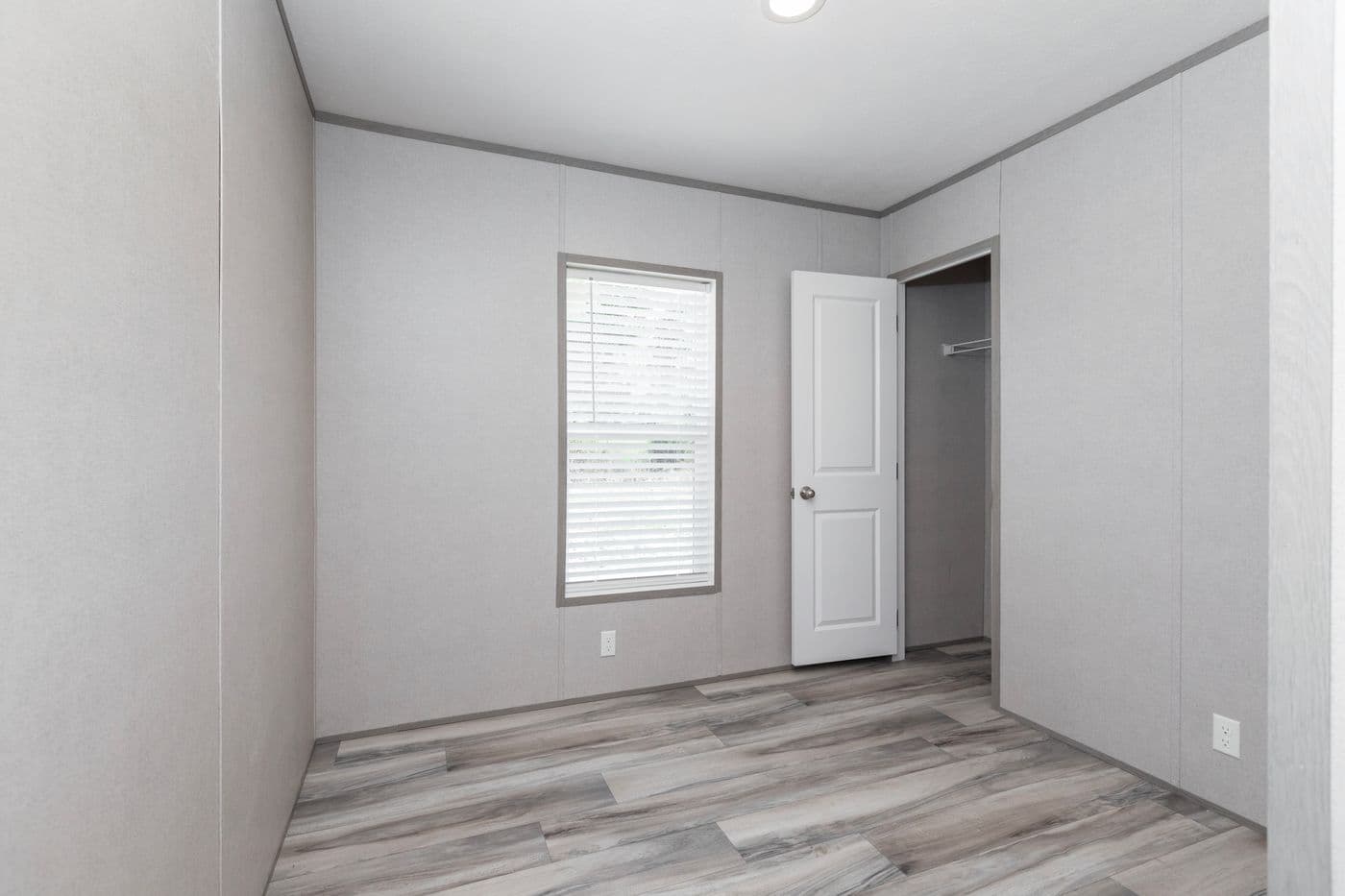 The THE OLYMPUS Guest Bedroom. This Manufactured Mobile Home features 3 bedrooms and 2 baths.