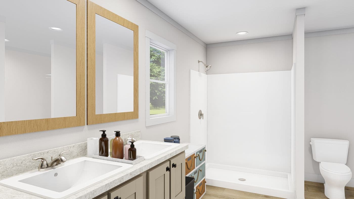 The LET IT BE Primary Bathroom. This Manufactured Mobile Home features 3 bedrooms and 2 baths.