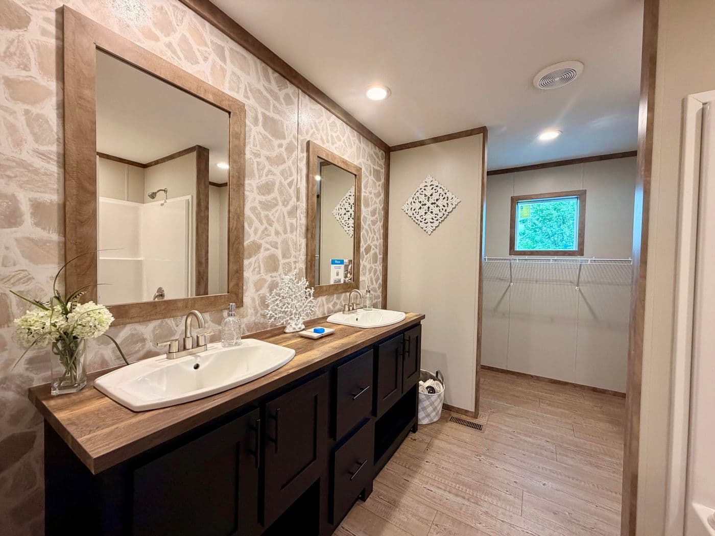 The BOONE Primary Bathroom. This Manufactured Mobile Home features 4 bedrooms and 2 baths.
