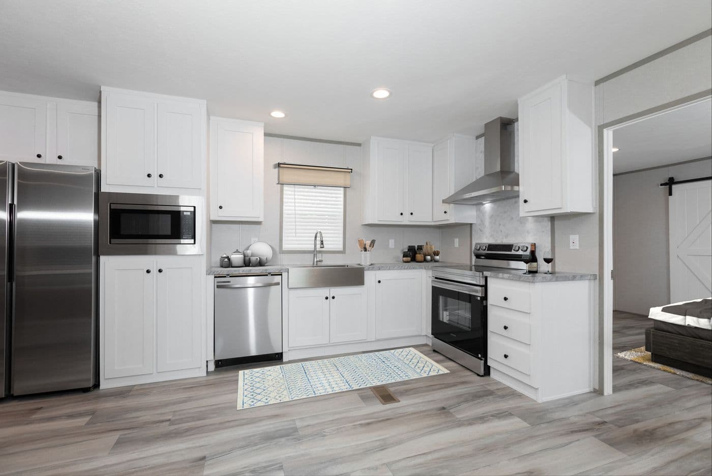 The THE ULTIMATE SHOWER Kitchen. This Manufactured Mobile Home features 3 bedrooms and 2 baths.