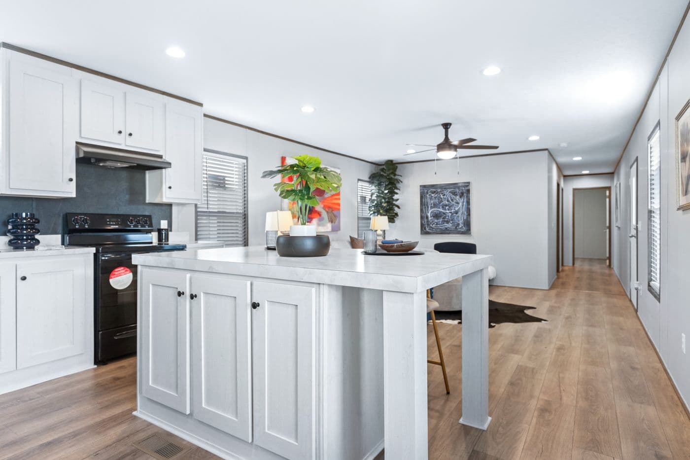 The HOMESTEAD 16763A Kitchen. This Manufactured Mobile Home features 3 bedrooms and 2 baths.