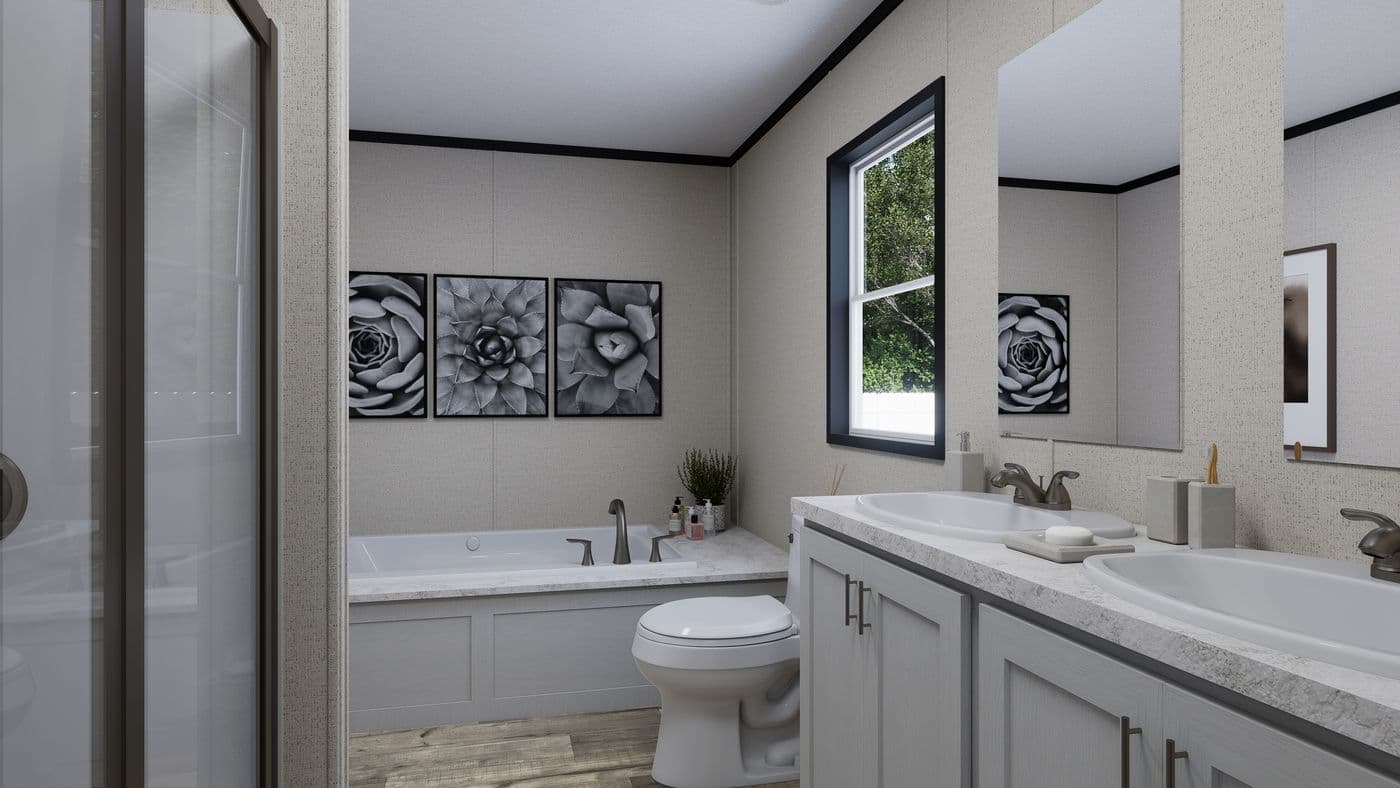 The THE MOUNTAINEER 52 Primary Bathroom. This Manufactured Mobile Home features 3 bedrooms and 2 baths.