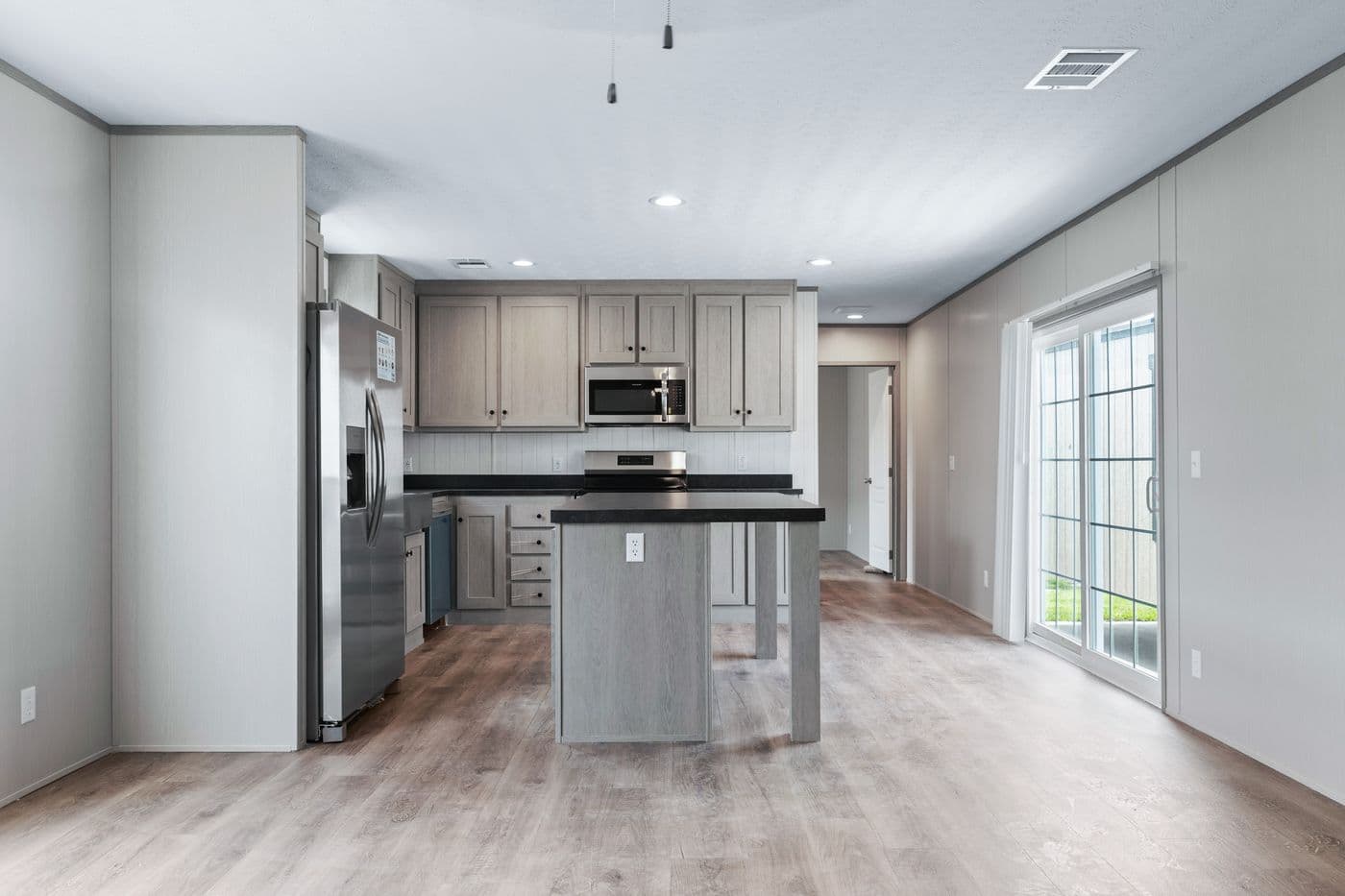 The RESOLUTION 16763H Kitchen. This Manufactured Mobile Home features 3 bedrooms and 2 baths.