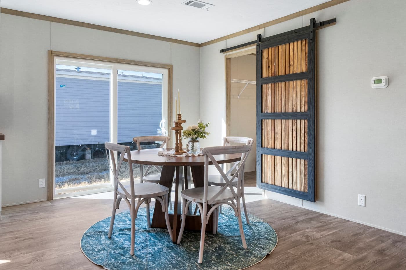 The THE BIG DEAL 52 Dining Room. This Manufactured Mobile Home features 3 bedrooms and 2 baths.