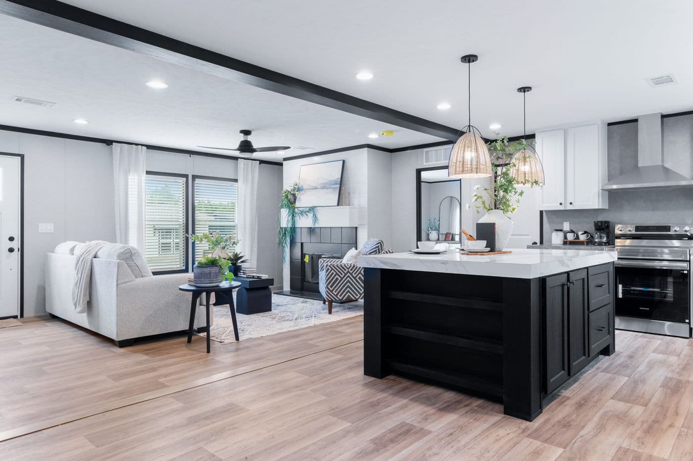 The ABSOLUTE VALUE Living Room. This Manufactured Mobile Home features 4 bedrooms and 2 baths.